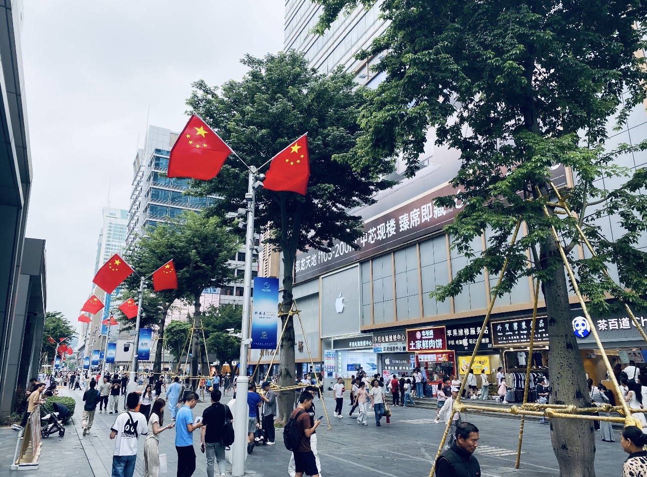Huaqiangbei pedestrian street — international brands sit alongside local electronics markets